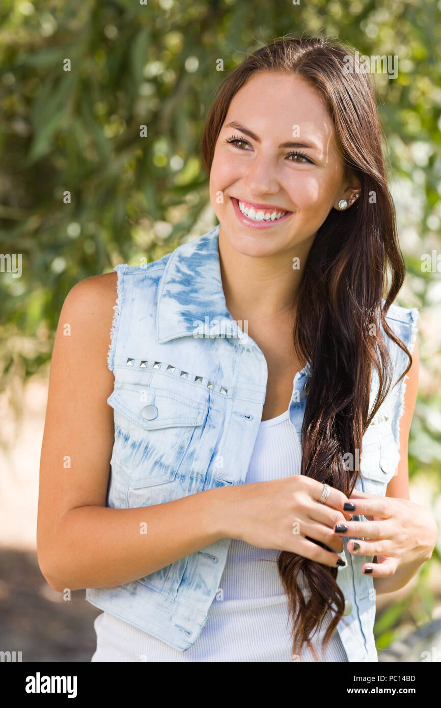 Attractive Smiling Mixed Race Girl Portrait Outdoors. Stock Photo