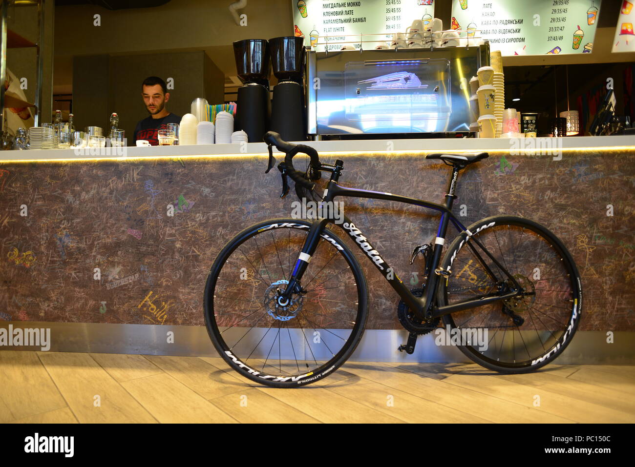 Racing bike, in a trendy coffee shop Stock Photo