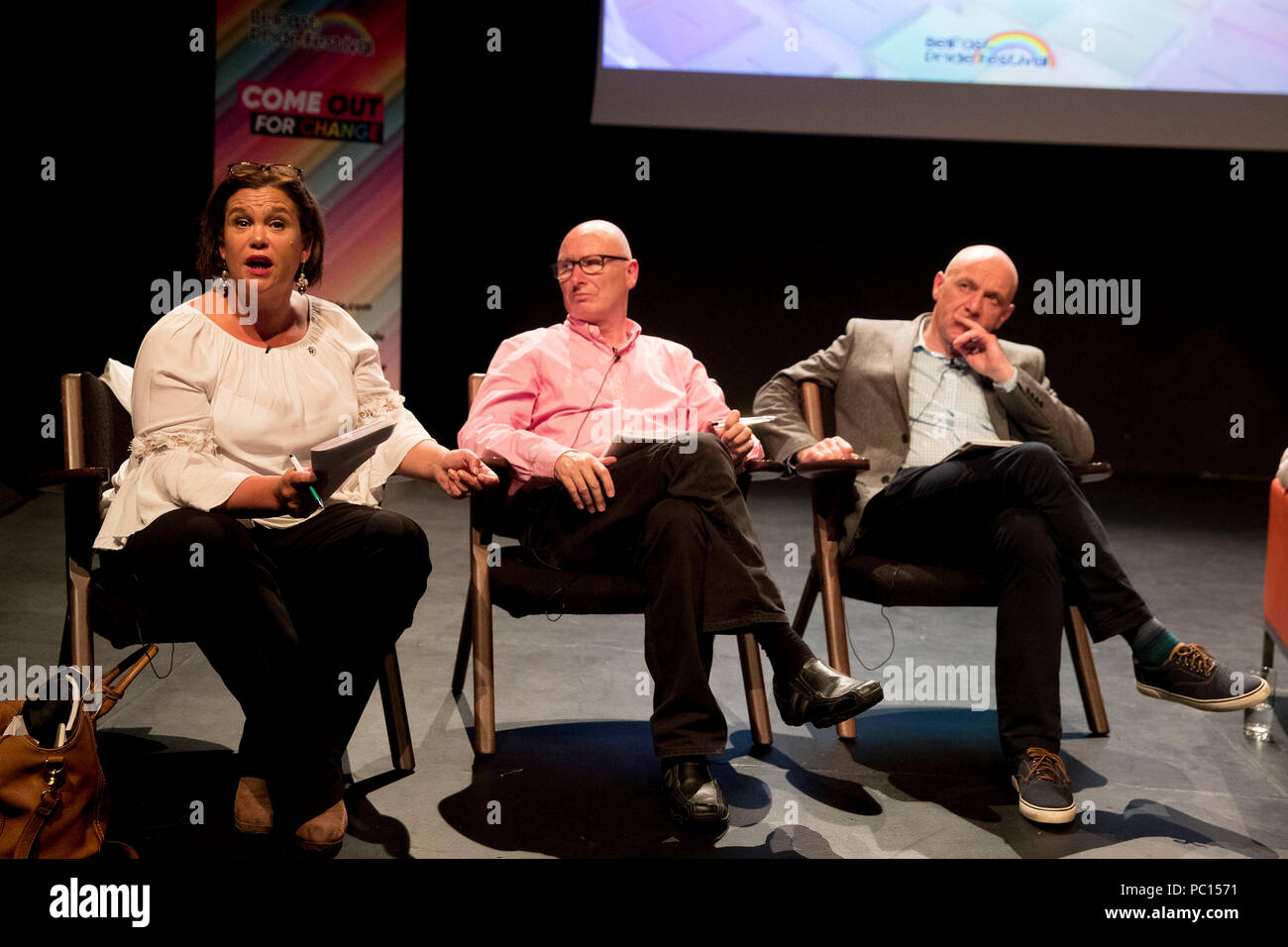 (left to right) Sinn Fein President Mary Lou McDonald speaking as leader of the PUP Billy Hutchinson and Alliance MLA John Blair look on during during the Belfast Pride political debate at The Mac Theatre in Belfast to address a wide range of equality issues in Northern Ireland at part of the 2018 Belfast Pride Festival. Stock Photo