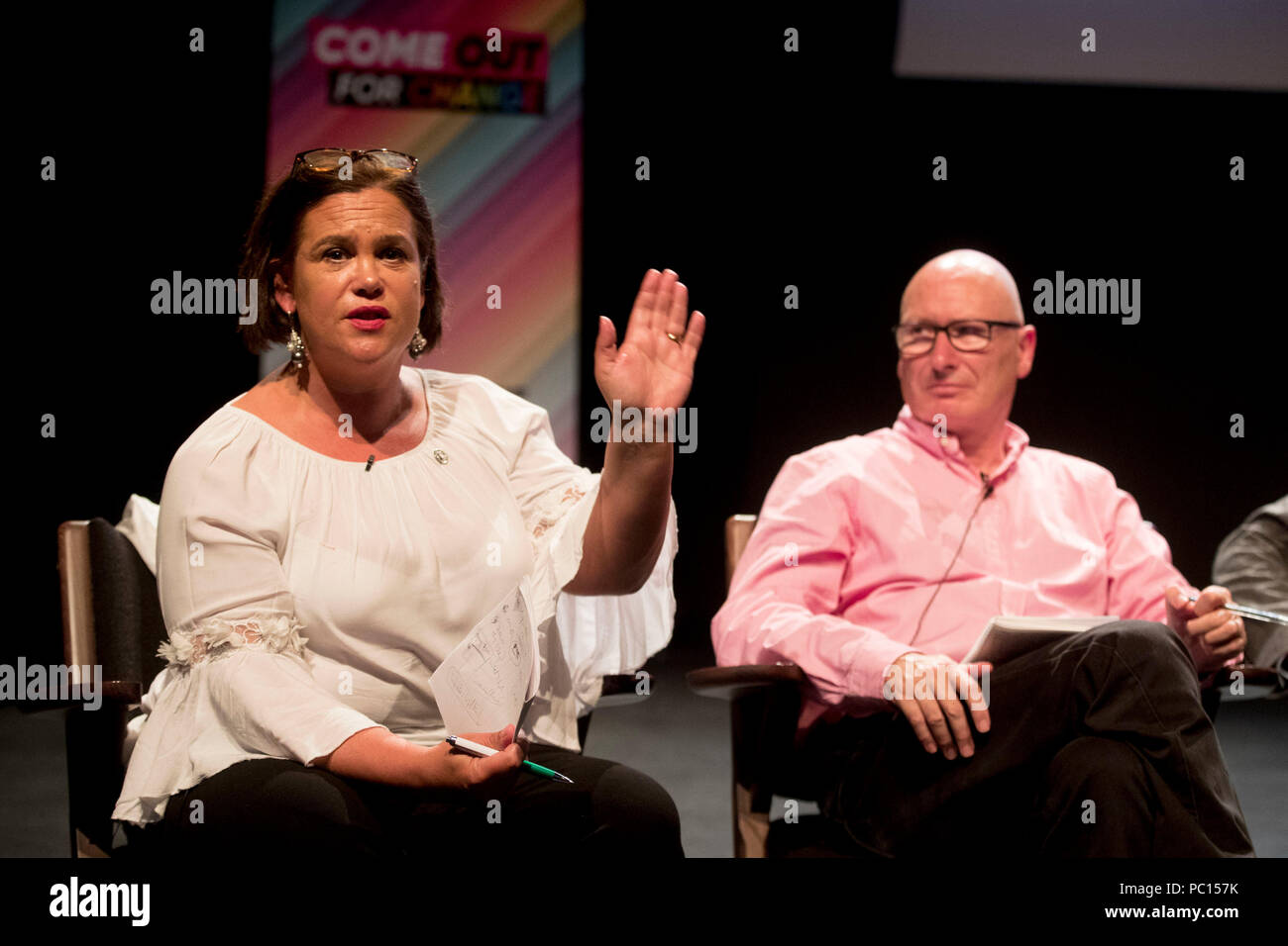 Sinn Fein President Mary Lou McDonald speaking as leader of the PUP Billy Hutchinson looks on, during the Belfast Pride political debate at The Mac Theatre in Belfast to address a wide range of equality issues in Northern Ireland at part of the 2018 Belfast Pride Festival. Stock Photo