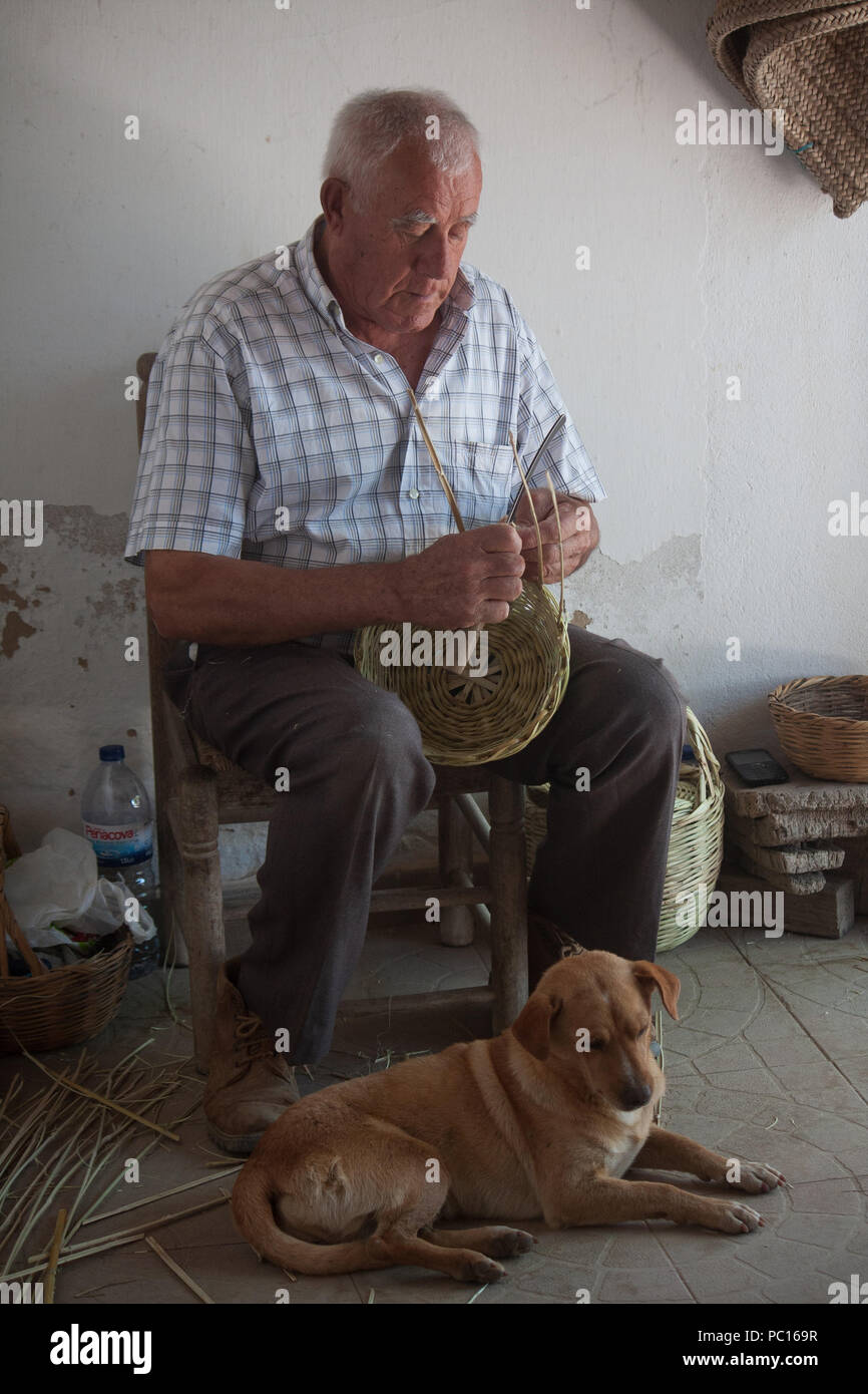 Basket Weaver & his dog, Algarve, Portugal, Europe Stock Photo