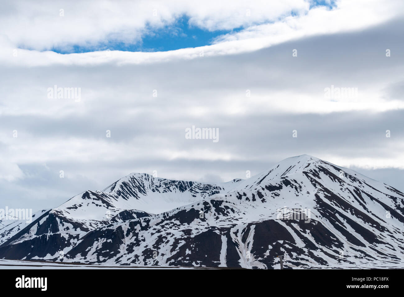 Beautiful  snow covered mountains in landscapes in Svalbard, Norway. Stock Photo