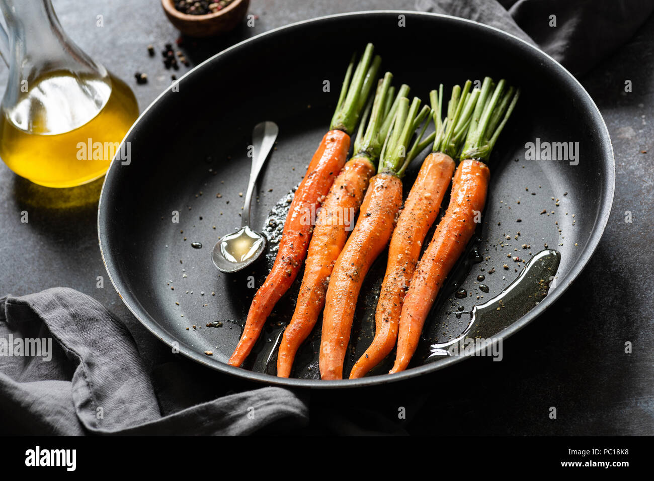Cooking carrots. Fresh carrots ready for cooking on a pan. Roast