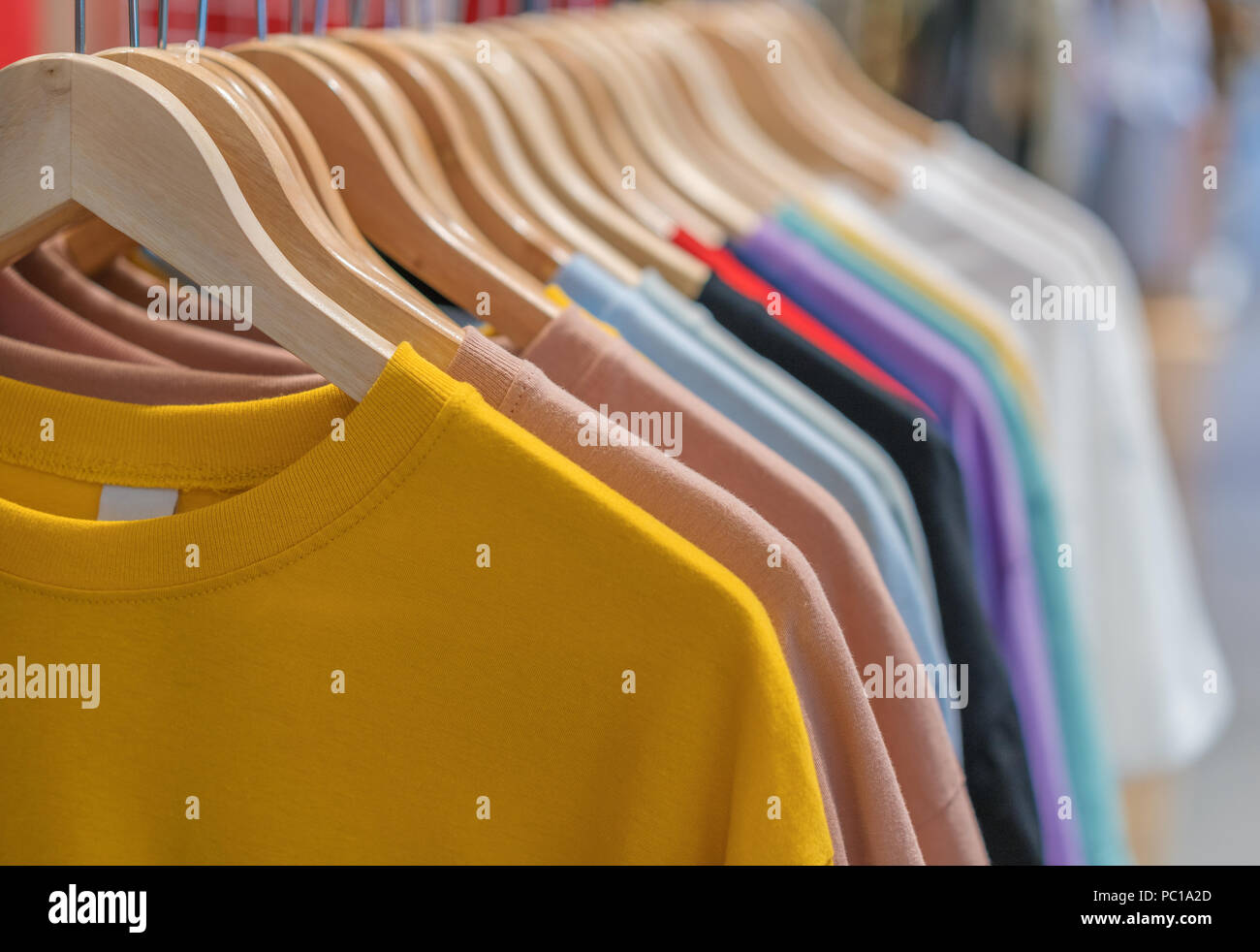 womens clothes on hangers in store Stock Photo