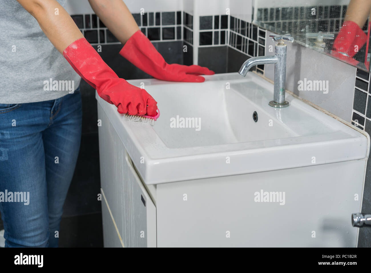 hand-cleaning-bathroom-sink-with-a-brush-stock-photo-alamy