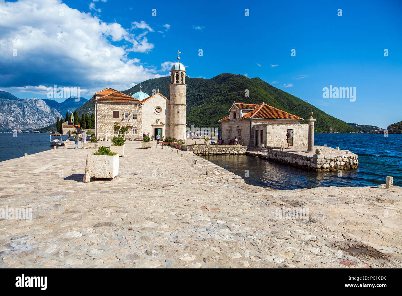 Perast, Montenegro - July, 2018: Small islet near Perast city in Montenegro with he roman catholic Church of Our Lady of the Rocks Stock Photo