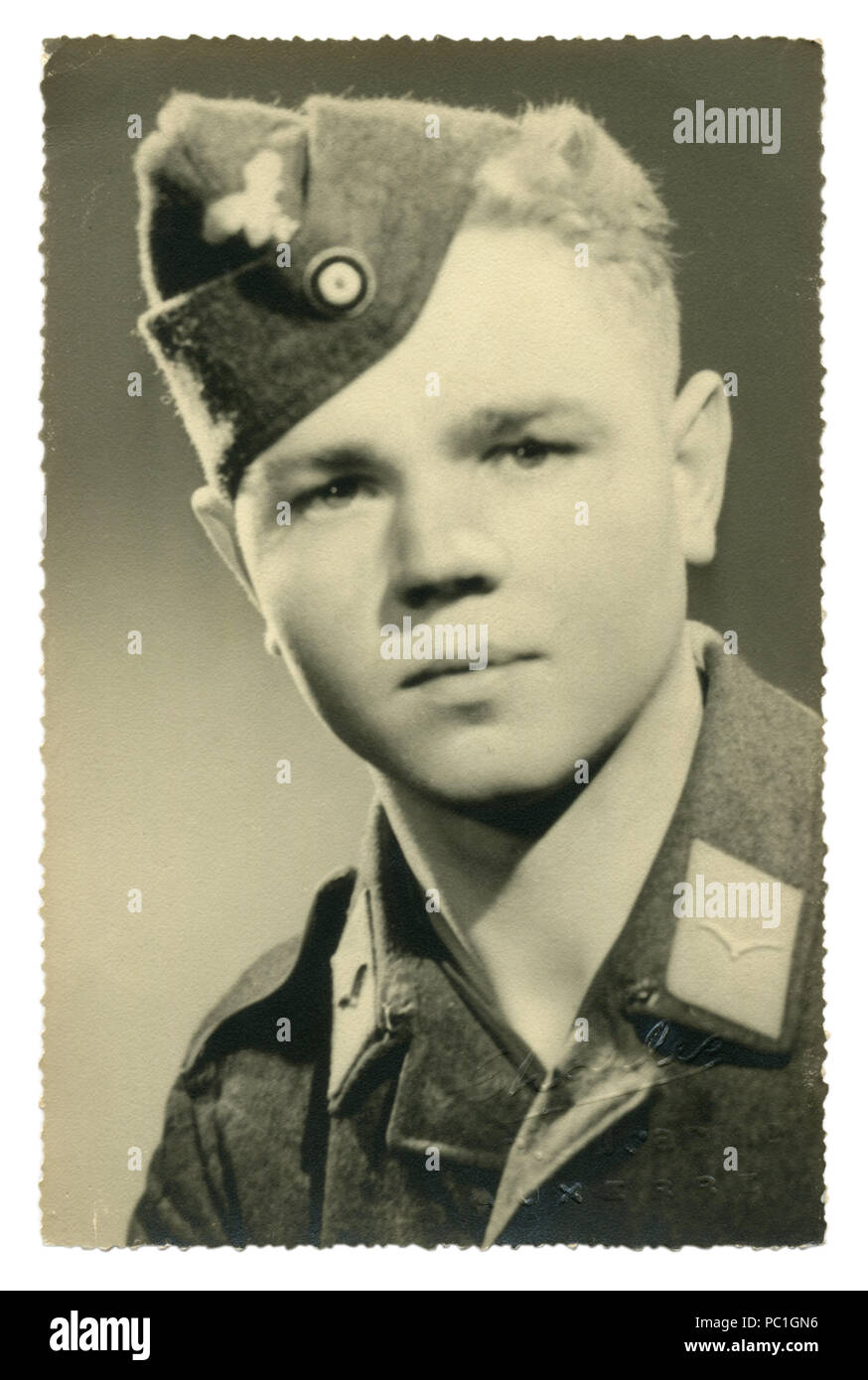 German historical photo: young handsome man, private air force in military uniform, Luftwaffe, Studio photography, 1943, world war two, Germany Stock Photo