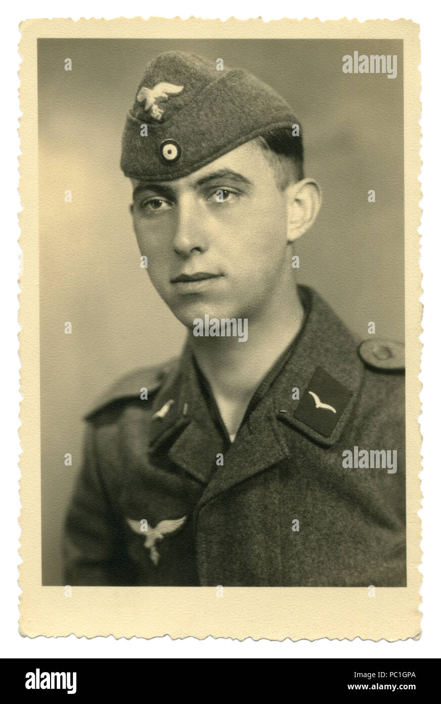 German historical photo: young handsome man, private air force in military uniform, Luftwaffe, Studio photography, world war two, Germany, Third Reich Stock Photo
