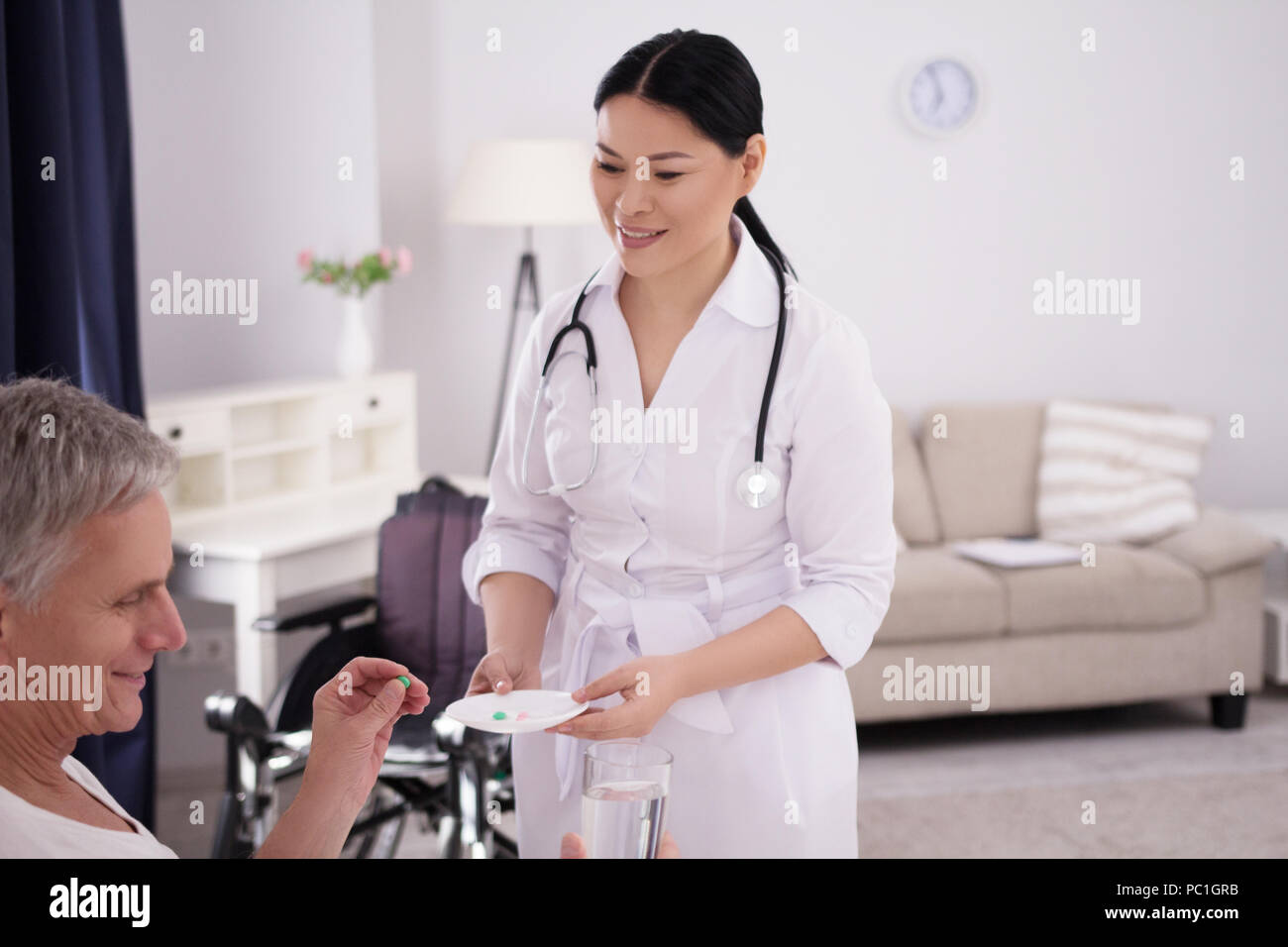 Nurse giving medication Stock Photo Alamy