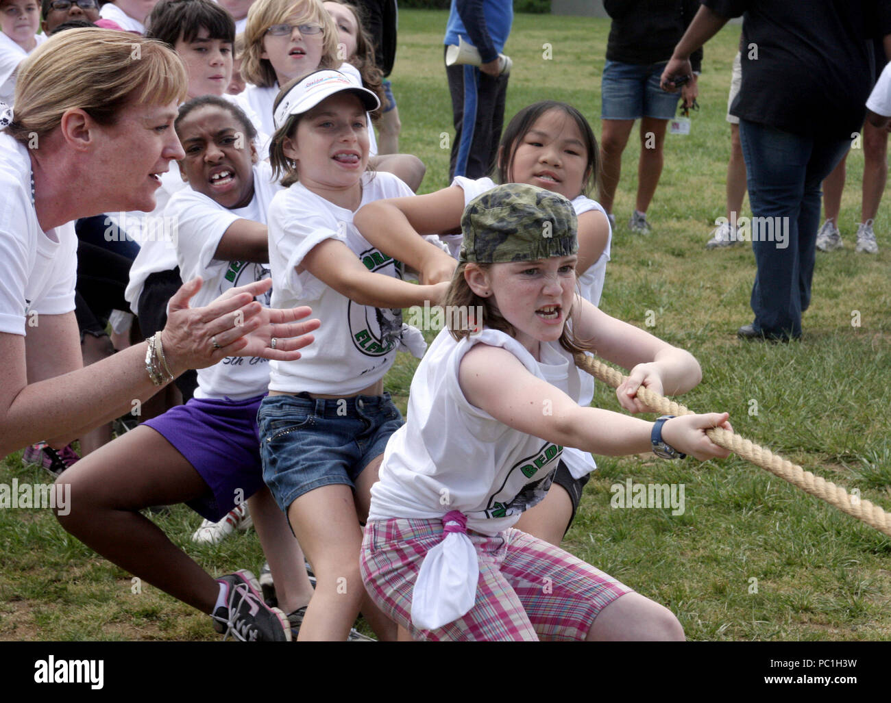 Children competing in a Tug of War challenge Stock Photo