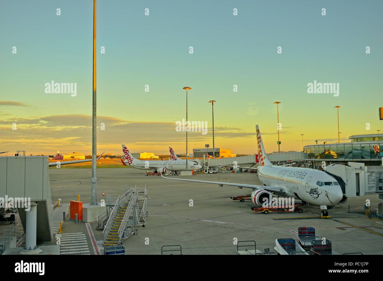 Brisbane, Queensland, Australia - June 23, 2018: Virgin Airlines Terminal, planes getting loaded and unloaded. Stock Photo