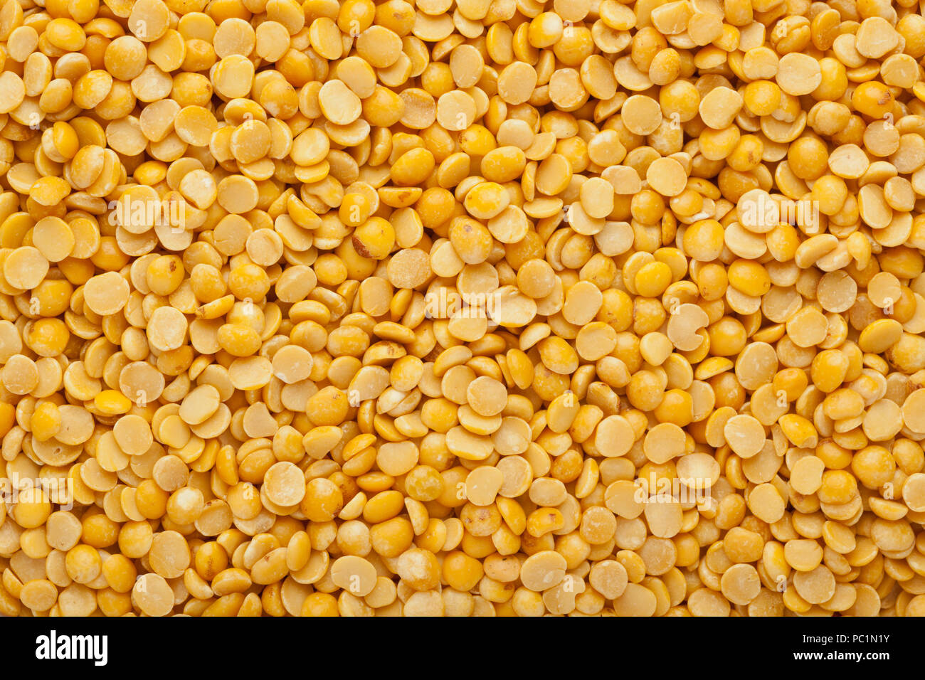 Split pigeon peas in a square bowl isolated on white background Stock Photo
