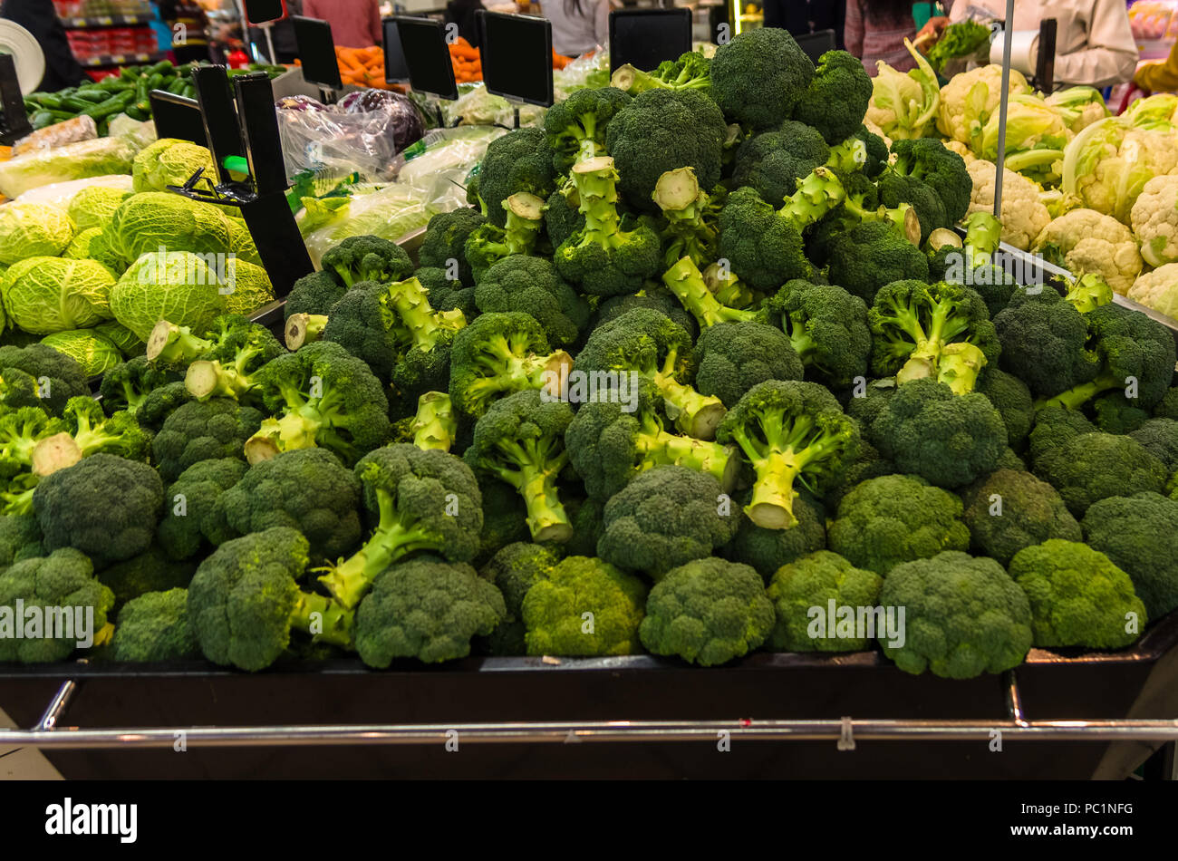 Bunch of broccoli's and other vegetables sold in a super market Stock Photo