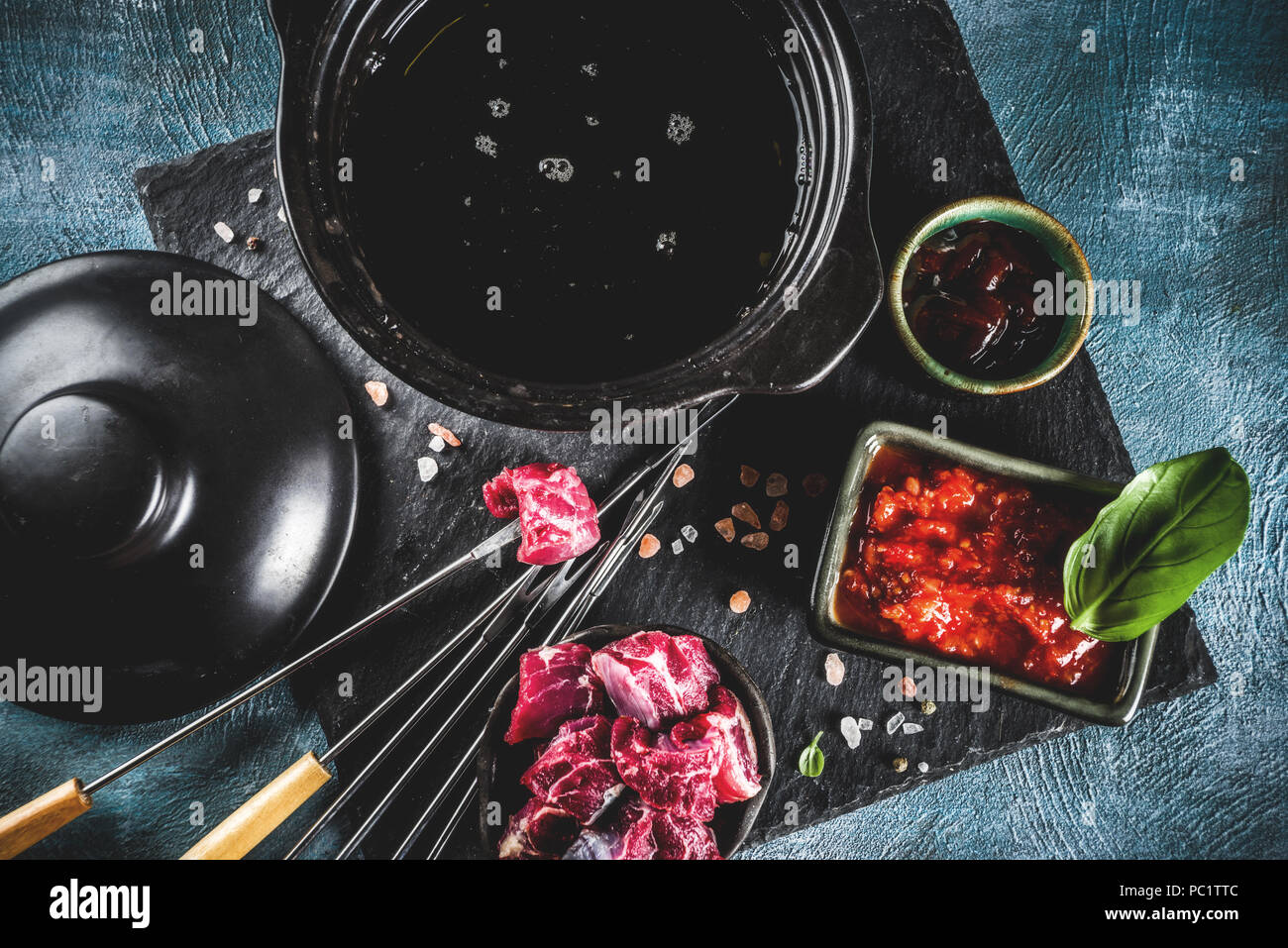 Beef meat fondue, with different sauces, top view copy space Stock