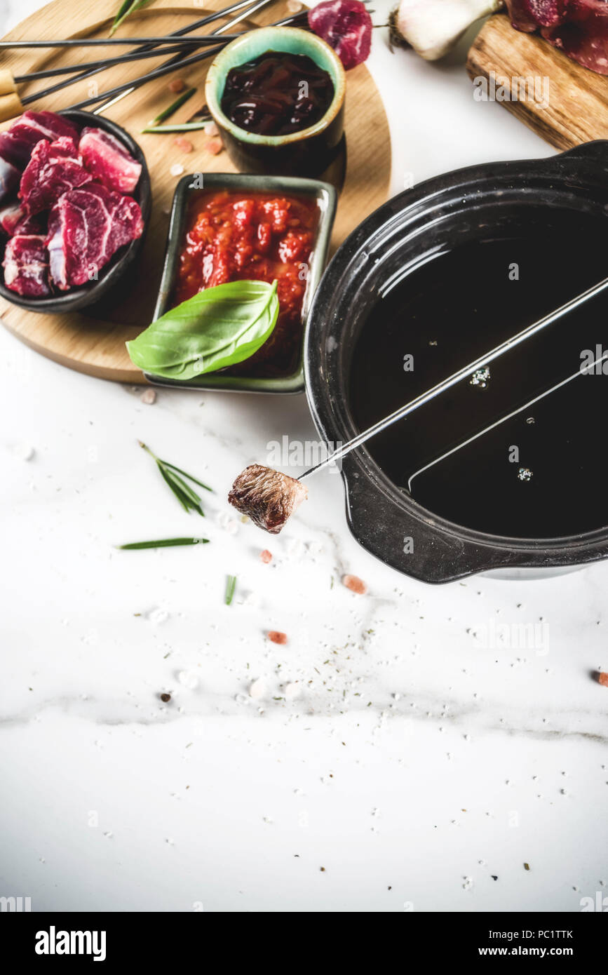 Beef meat fondue, with different sauces, top view copy space Stock Photo Alamy