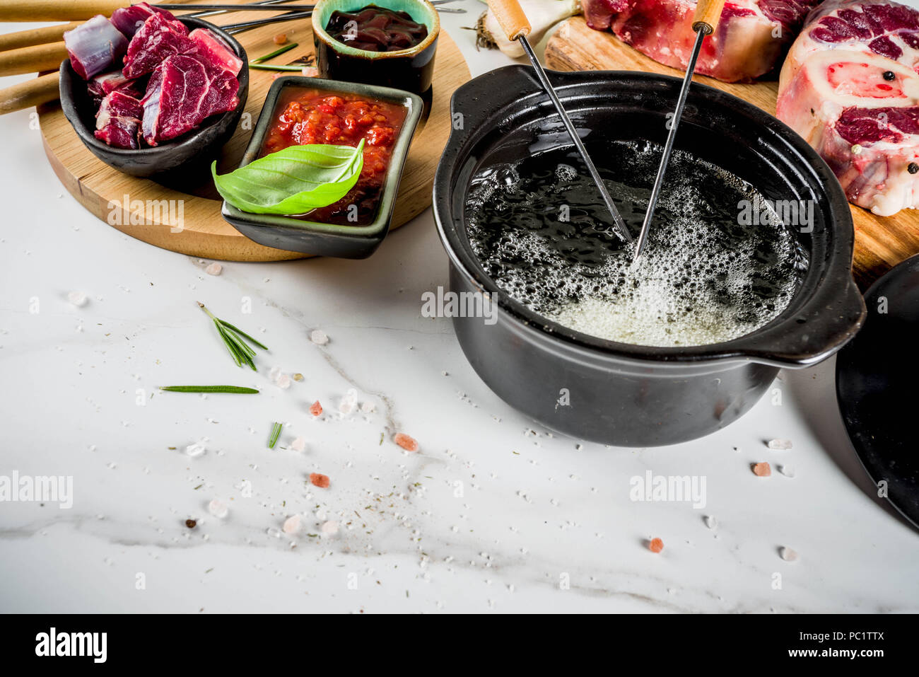 Beef meat fondue, with different sauces, top view copy space Stock