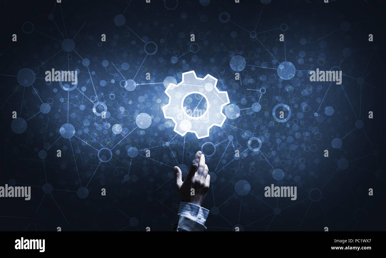 Technology conceptual image with gear digital symbol on dark background Stock Photo