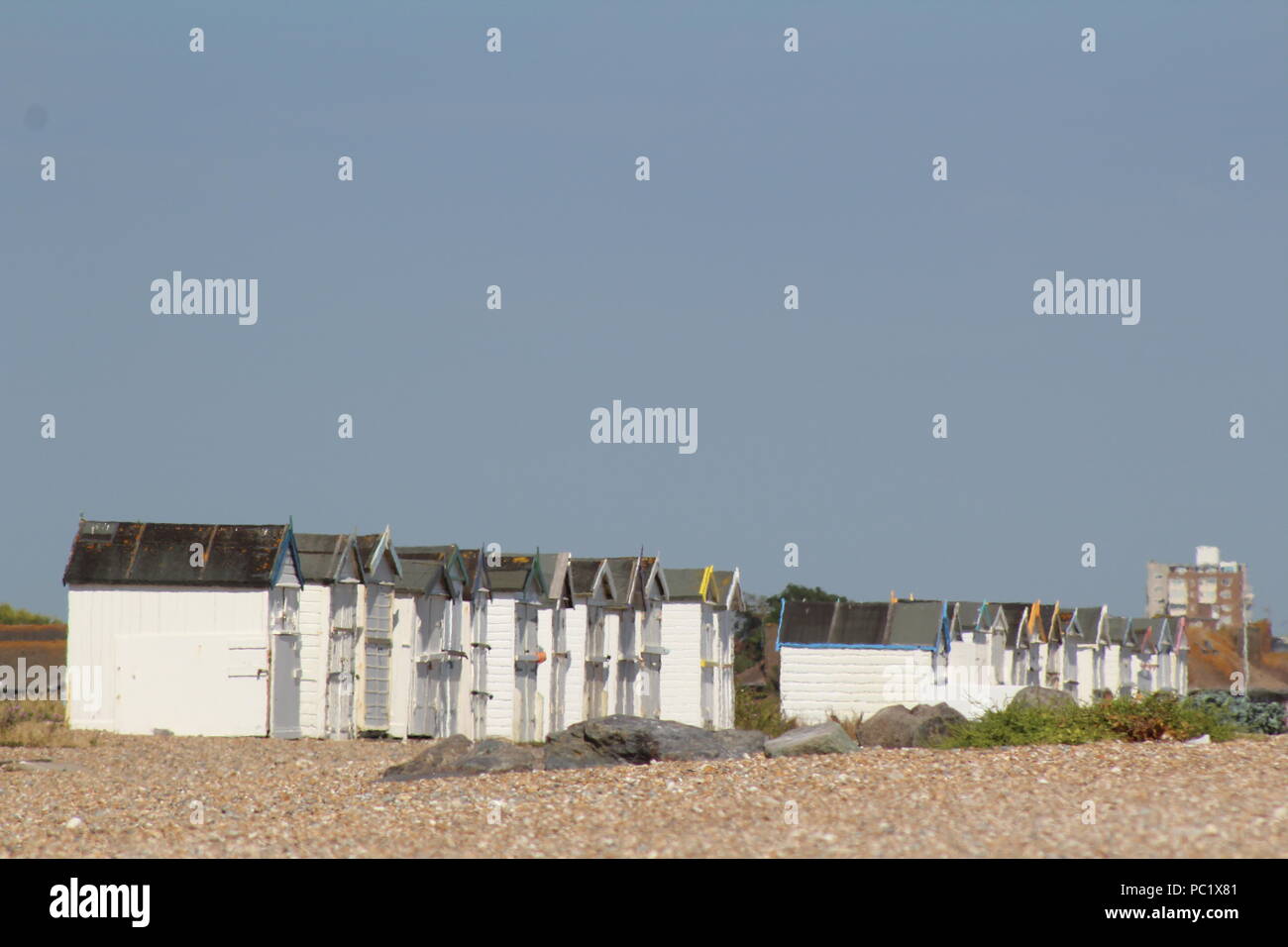 row of beach huts at goringbysea Stock Photo Alamy