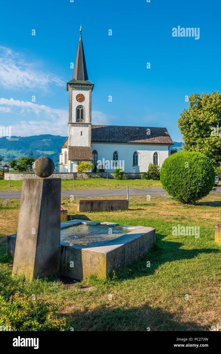 The beautiful village church of Busskirch on the shores on trhe Upper Zurich Lake, Sankt Gallen, Switzerland Stock Photo