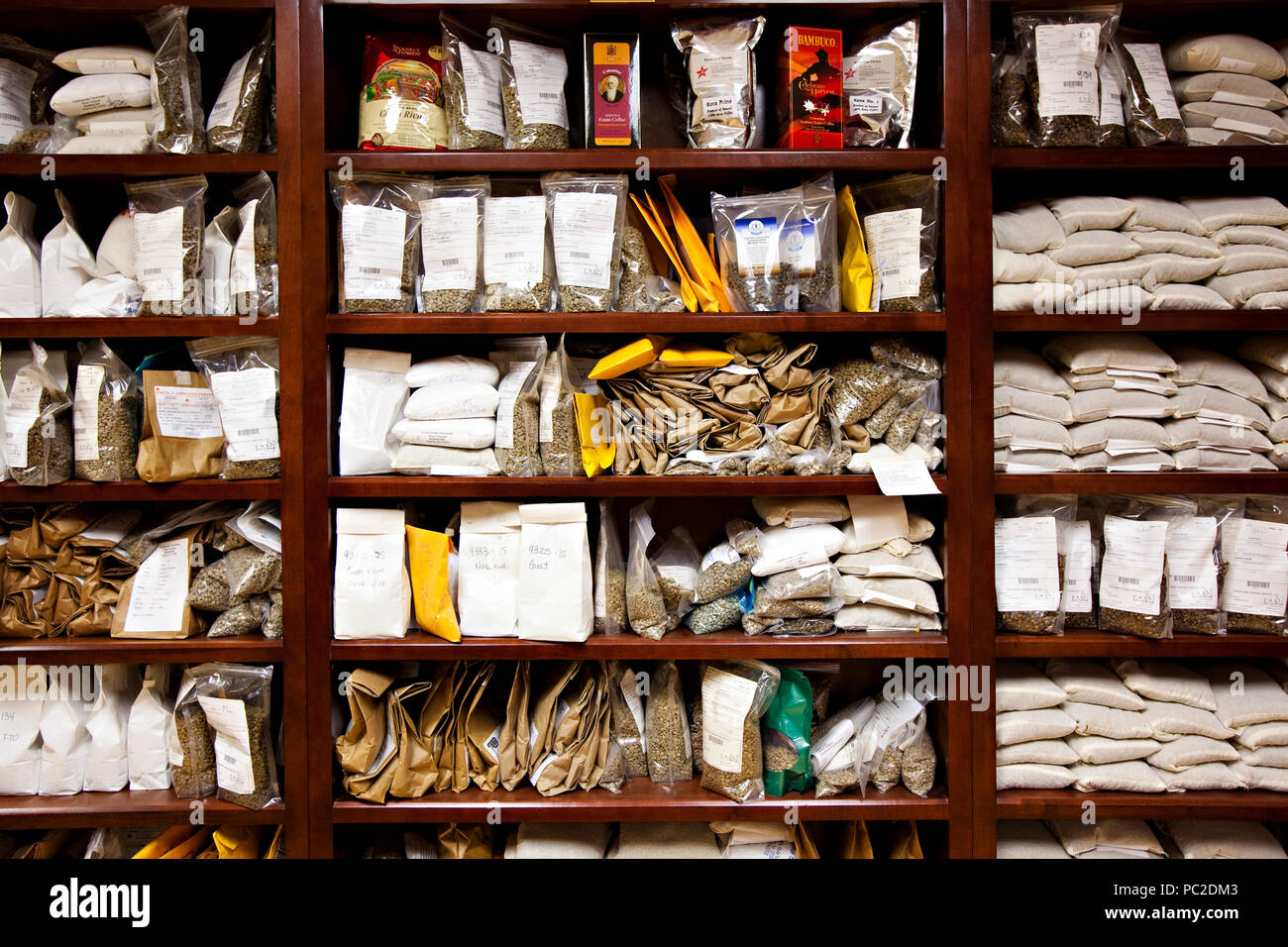 Packages organized on nice wooden shelves Stock Photo Alamy