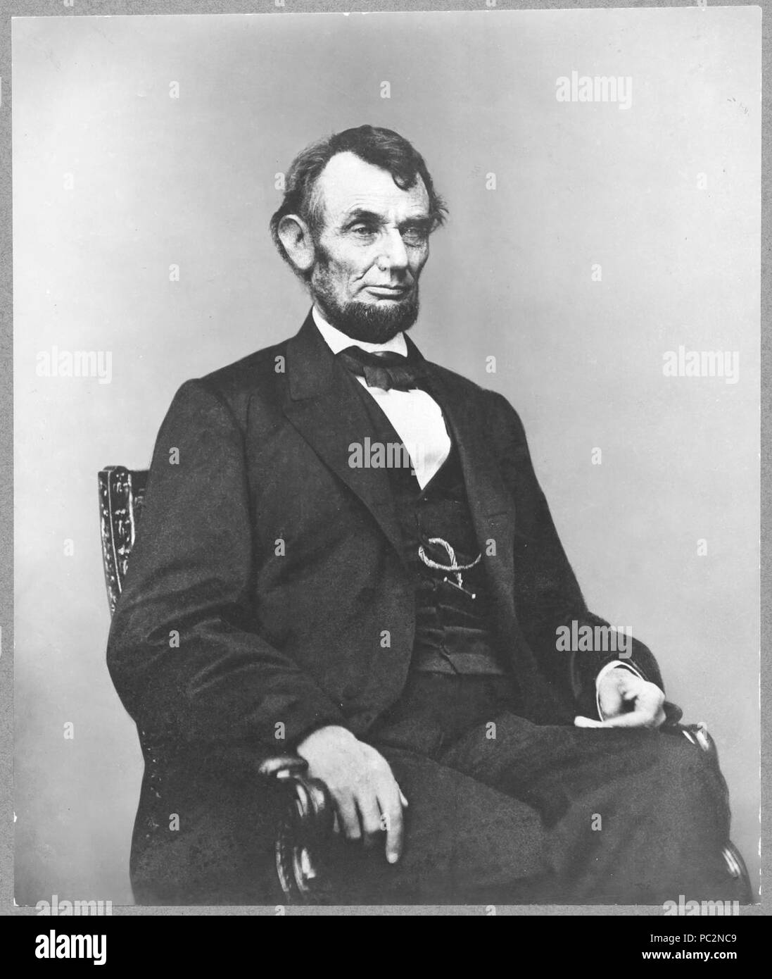 Abraham Lincoln, three-quarter length portrait, seated, facing right ...