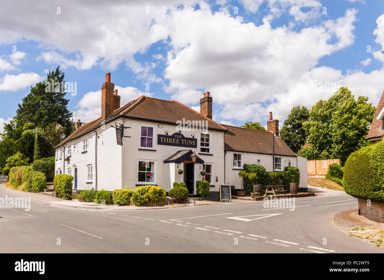 The Three Tuns, a traditional free house country pub in Great Bedwyn, a rural village community in Wiltshire, southern England on a sunny summer day Stock Photo