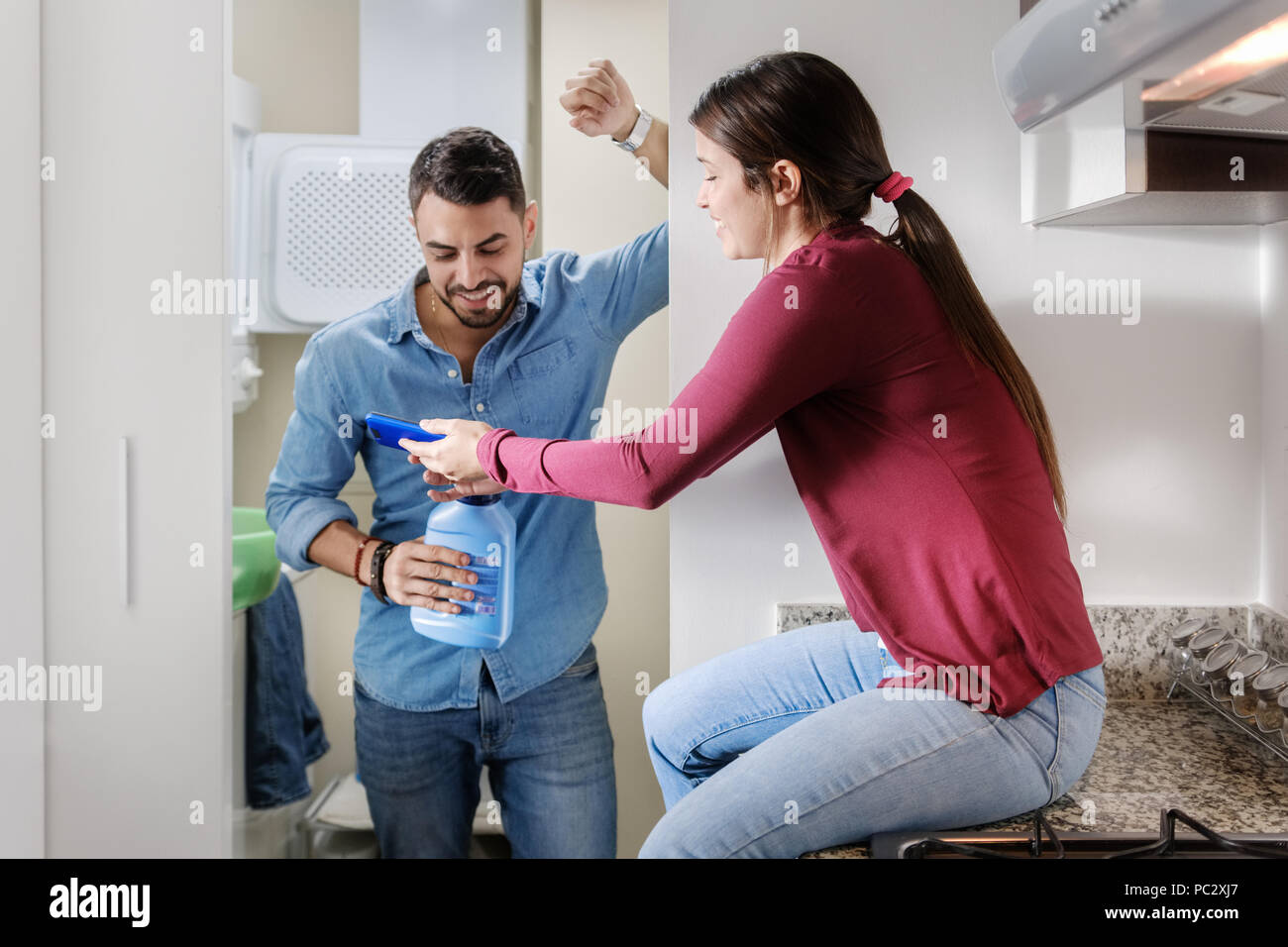 Man And Woman Doing Chores Washing Clothes Stock Photo