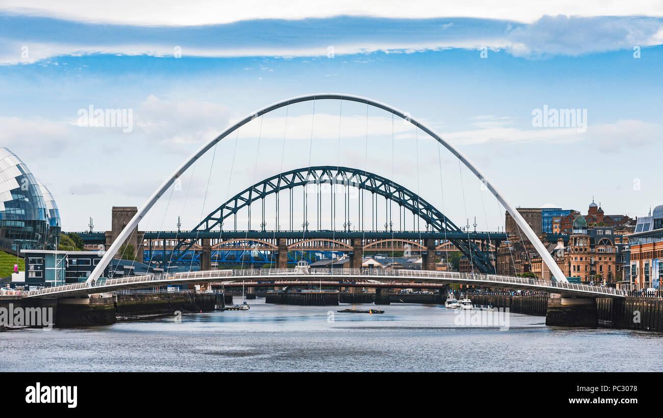 A view of the Gateshead Millennium Bridge on the River Tyne from Newcastle looking towards the Tyne Bridge. Stock Photo
