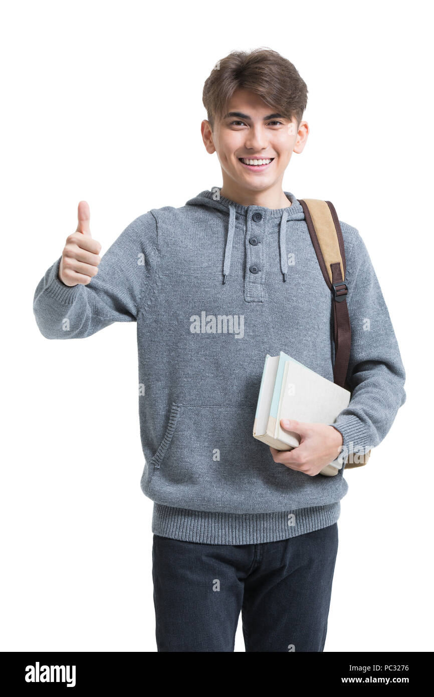 Cheerful male college student doing thumbs up Stock Photo - Alamy