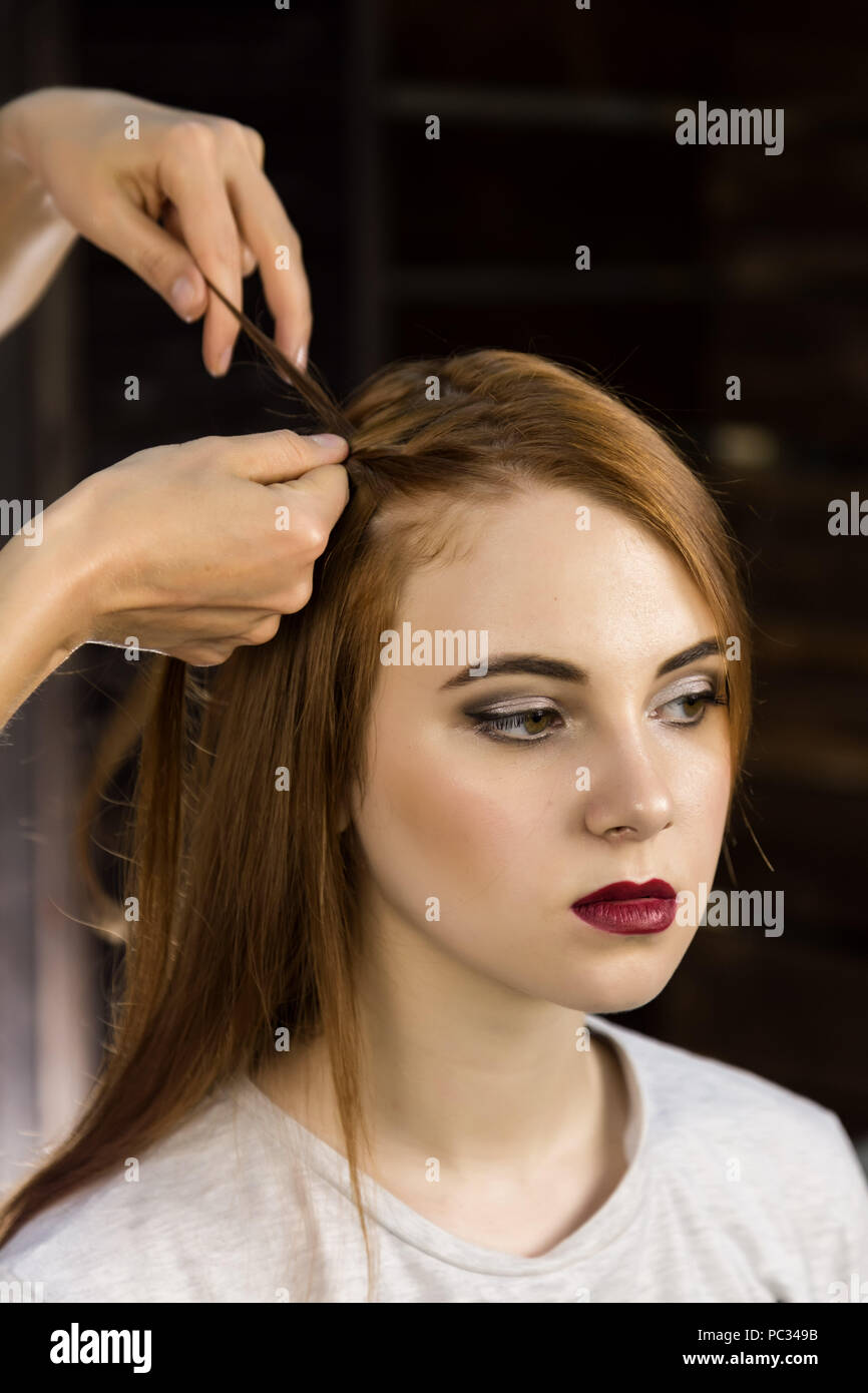Hairdresser Does Hairstyle For Young Woman To Weave Braids
