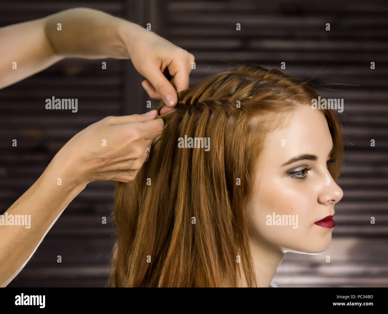 Hairdresser Does Hairstyle For Young Woman To Weave Braids