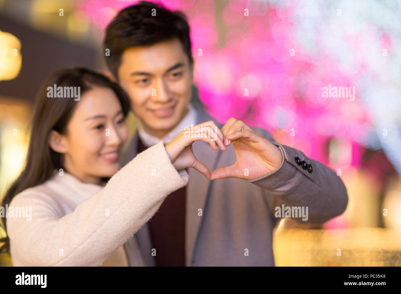 Young asian couple making heart hi-res stock photography and images - Alamy
