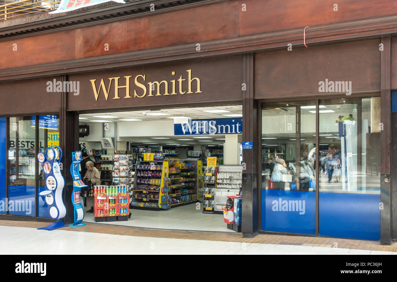 WHSmith retail unit with displays of goods, point of sale Lottery tickets display and customers; Glasgow Central Station. Scotland, UK Stock Photo