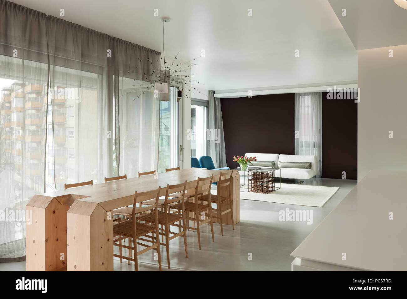 Luxury apartment, wooden dining table Stock Photo - Alamy - Rooftop Dining Furniture For Luxury Apartment Complex