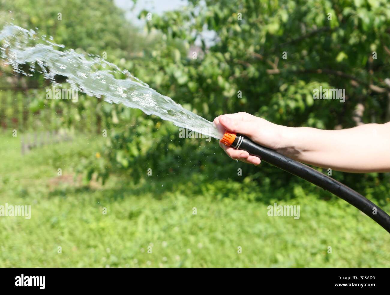 Close up shot of hand with hose Stock Photo