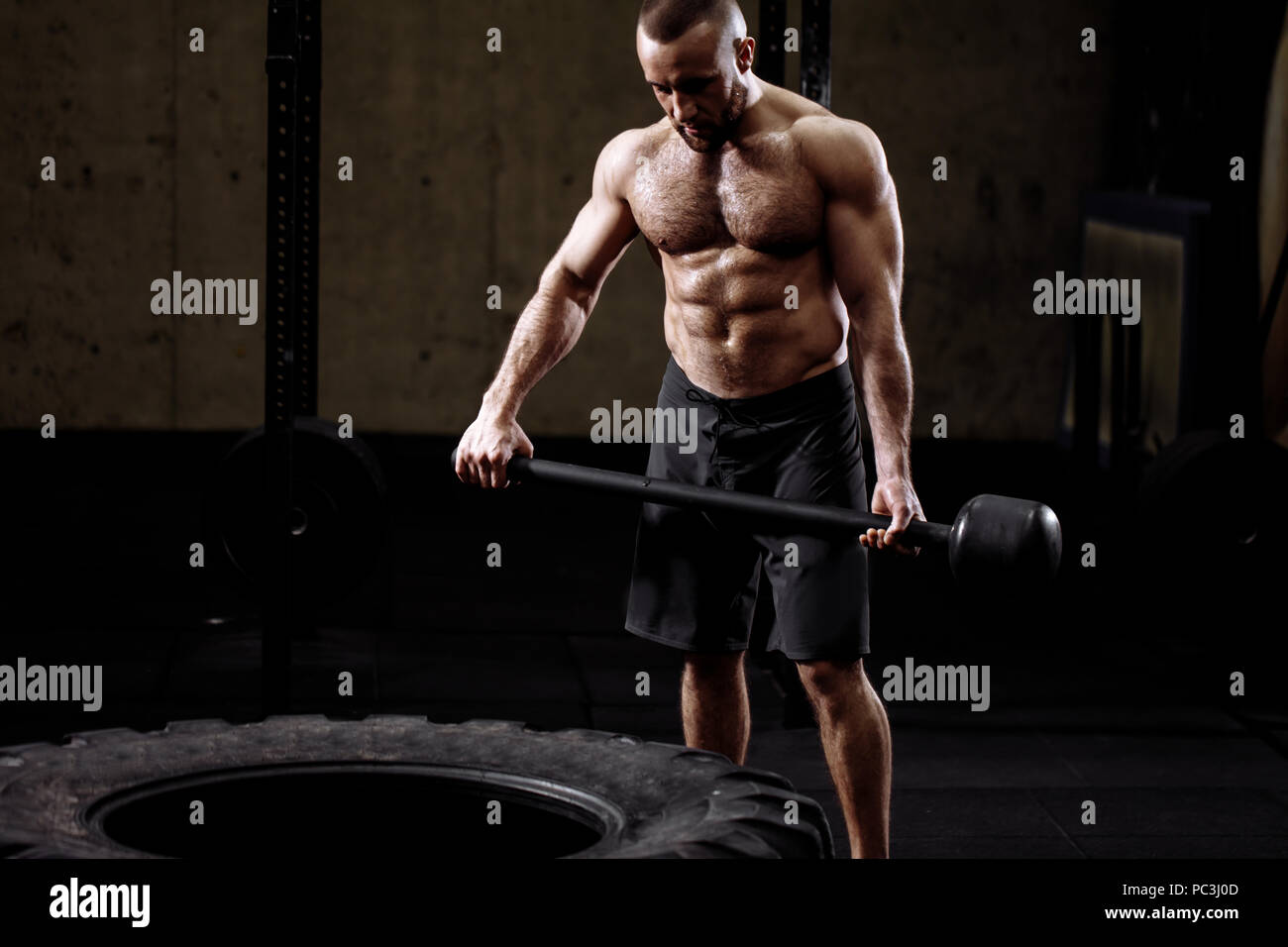 Crossfit Sledge Hammer Man Workout High Resolution Stock Photography