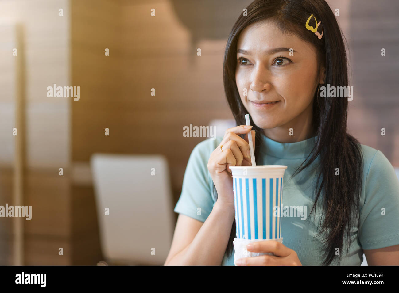 woman are drinking water by suction tube Stock Photo Alamy