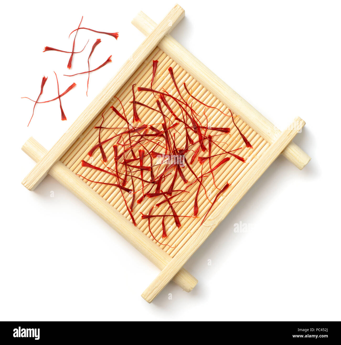 Saffron Thread Rope saffron thread in the wooden plate, isolated on white background Stock ...