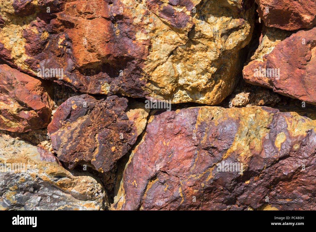 Ore in abandoned open cast mine, Parys Mountain, Anglesey, North Wales Stock Photo
