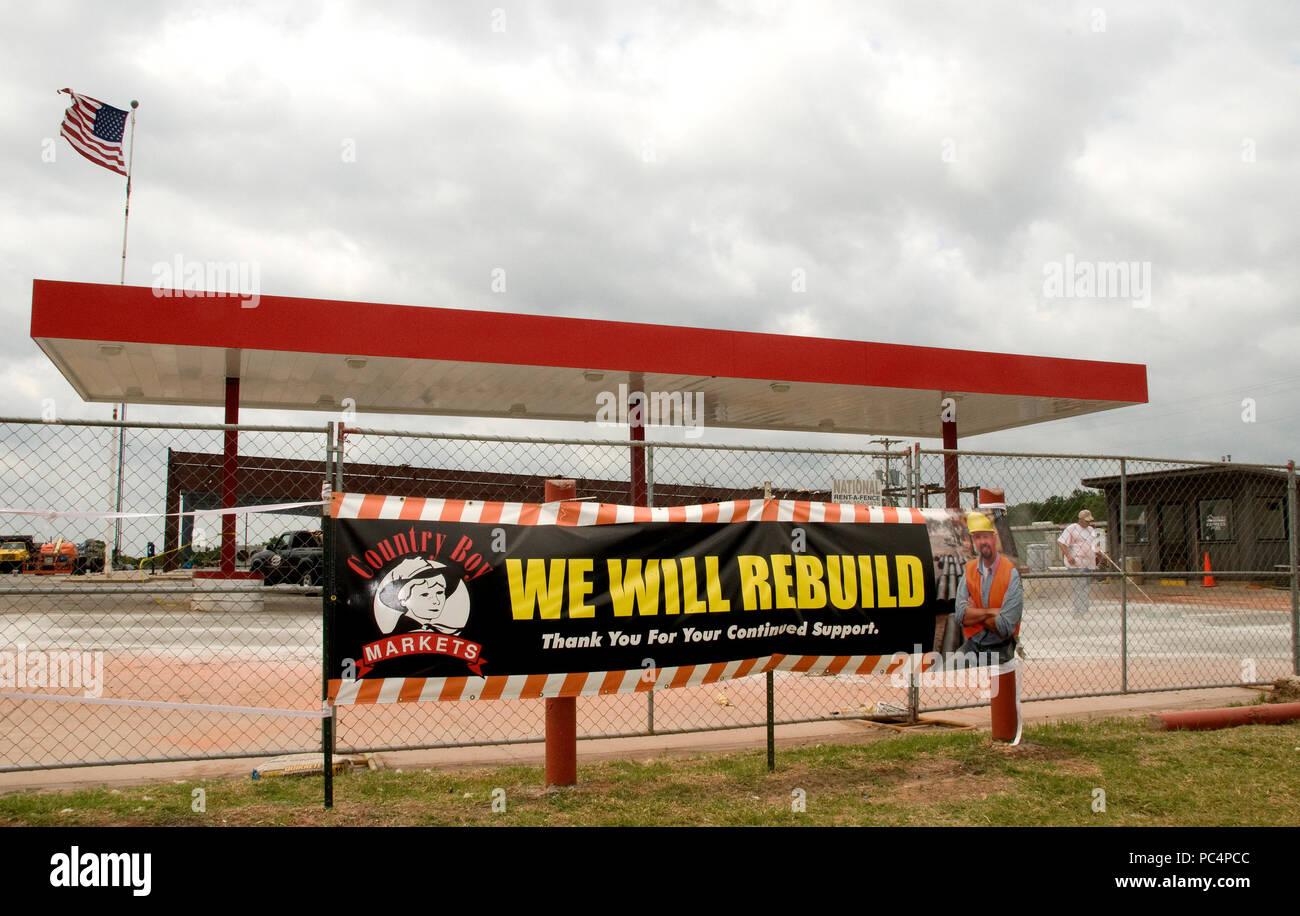 Norman,OK, June 12,2010A construction worker cleans the ground where