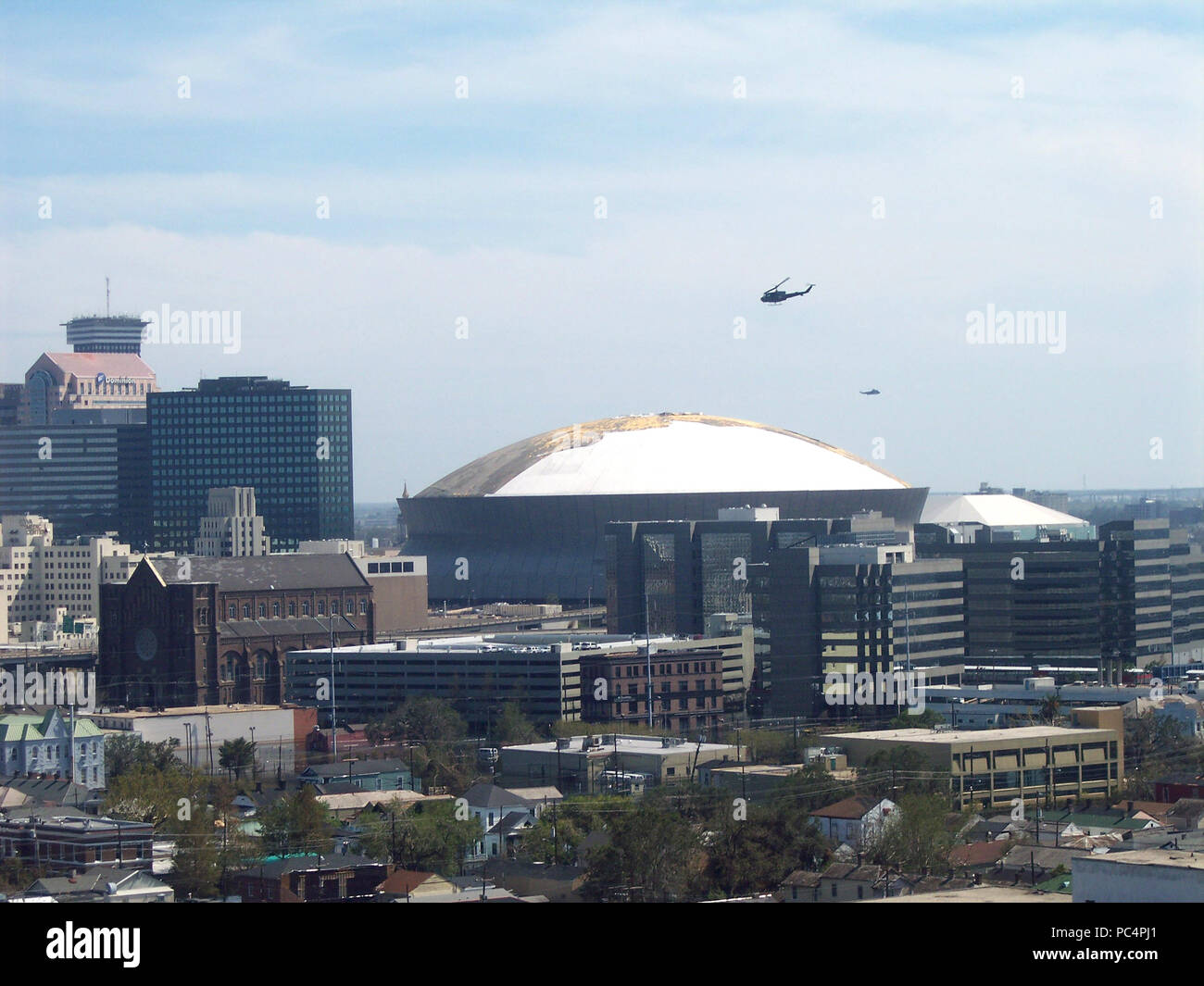 Hurricane Katrina Aftermath - wide view of helicopter flying near Superdome and other city buildings Stock Photo