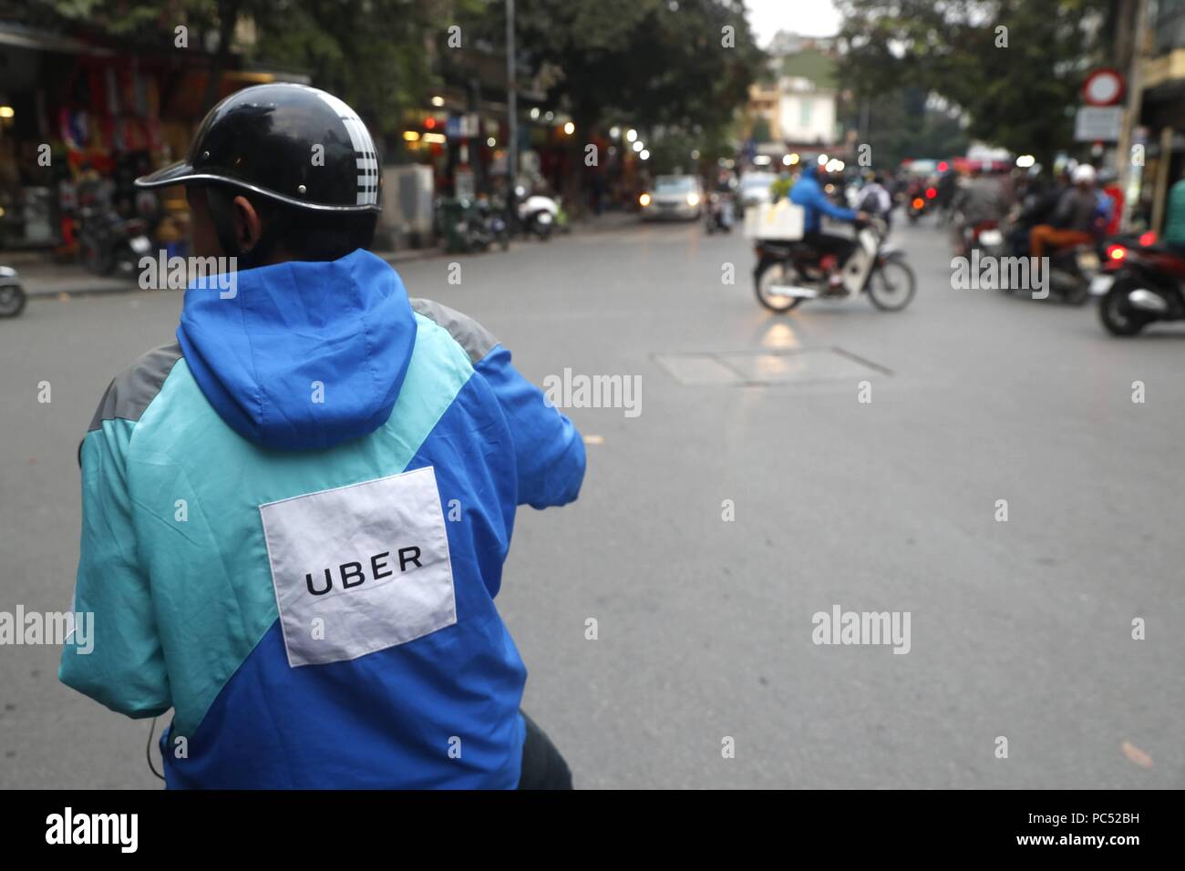 Motorbike uber driver. Hanoi. Vietnam.  usage worldwide Stock 
