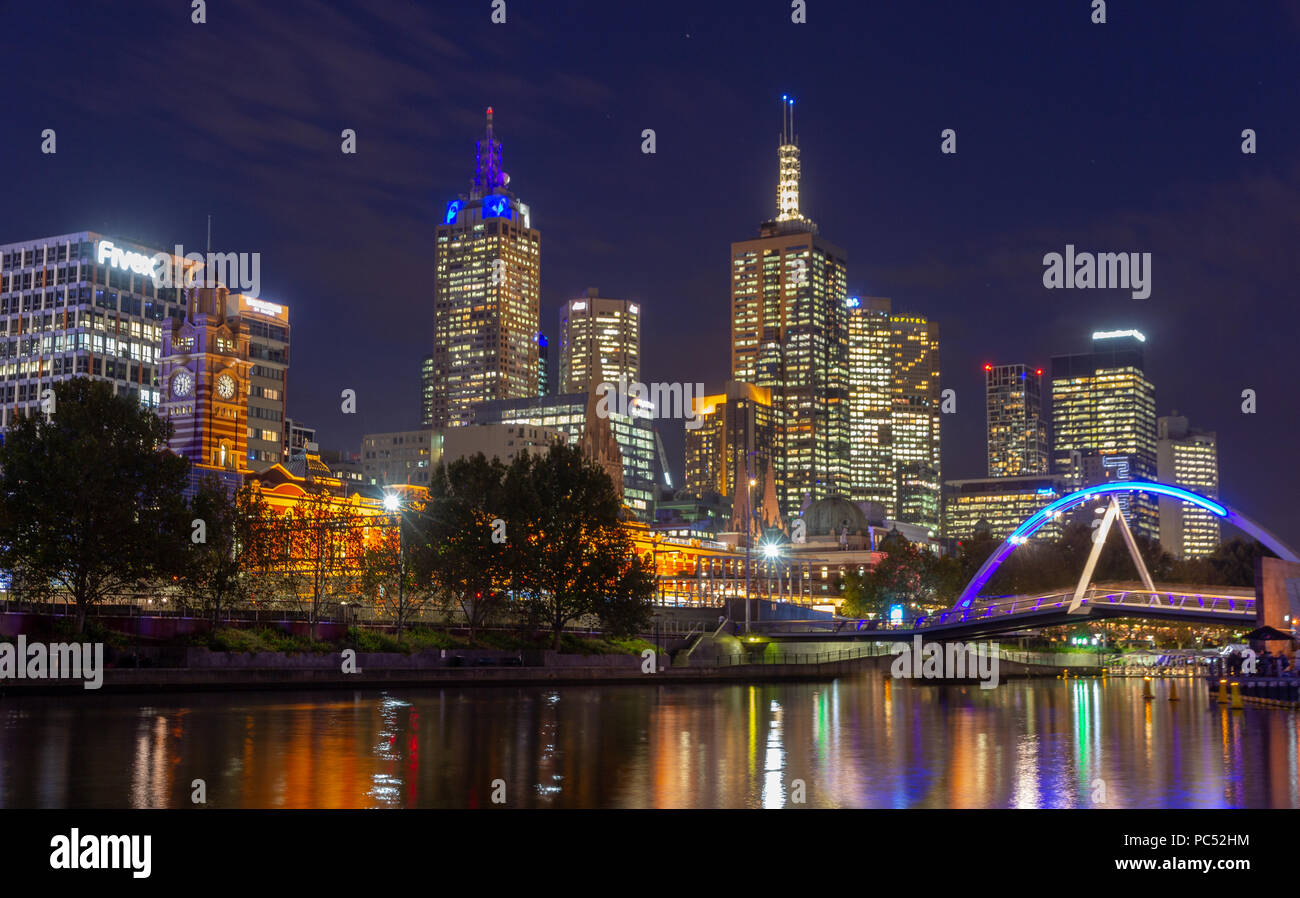 Yarra River and Melbourne city at night looking towards Flinders Street Station . Australia Stock Photo