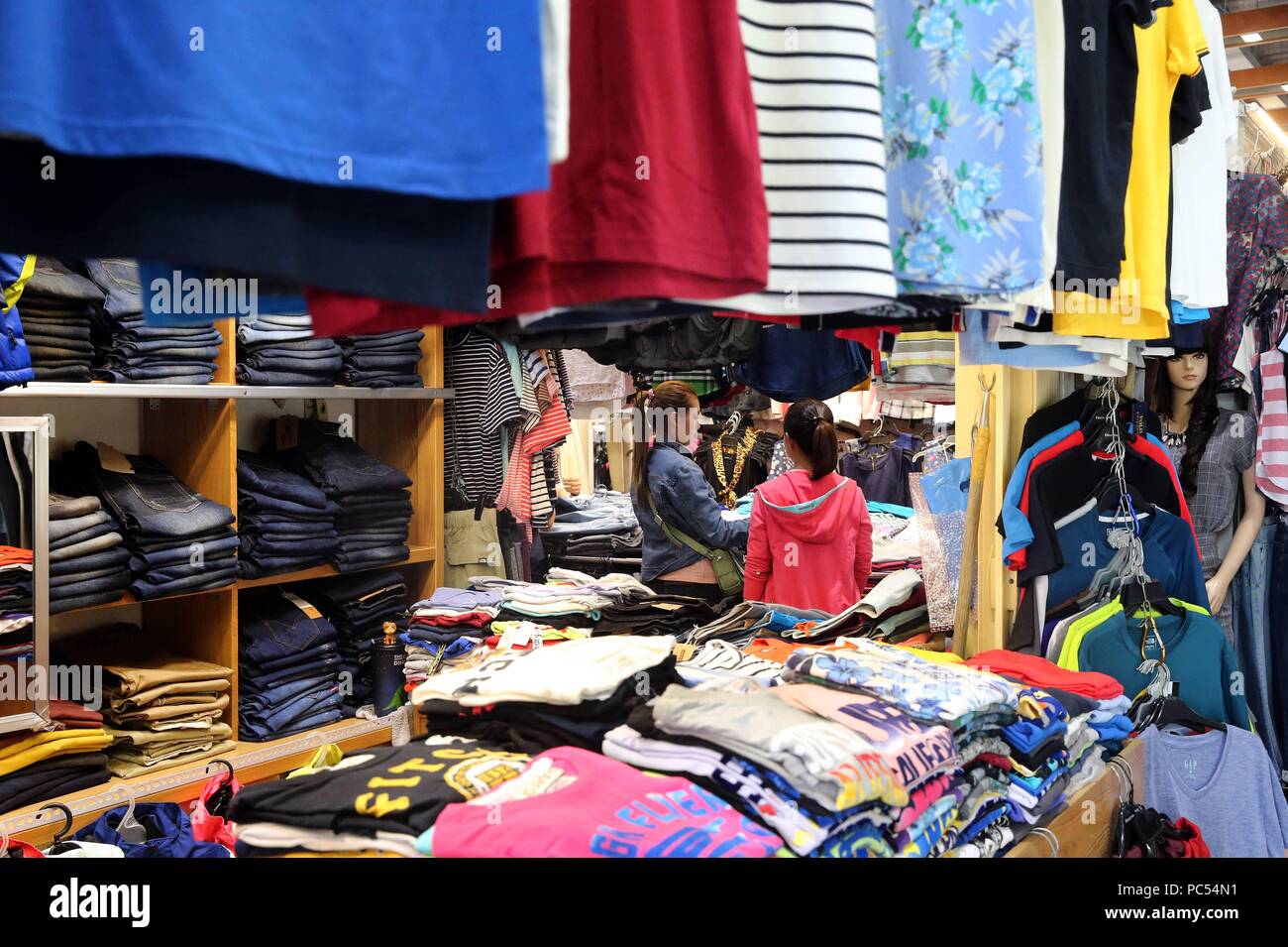 Clothing Market. Hangers with clothes. usage worldwide Stock Photo