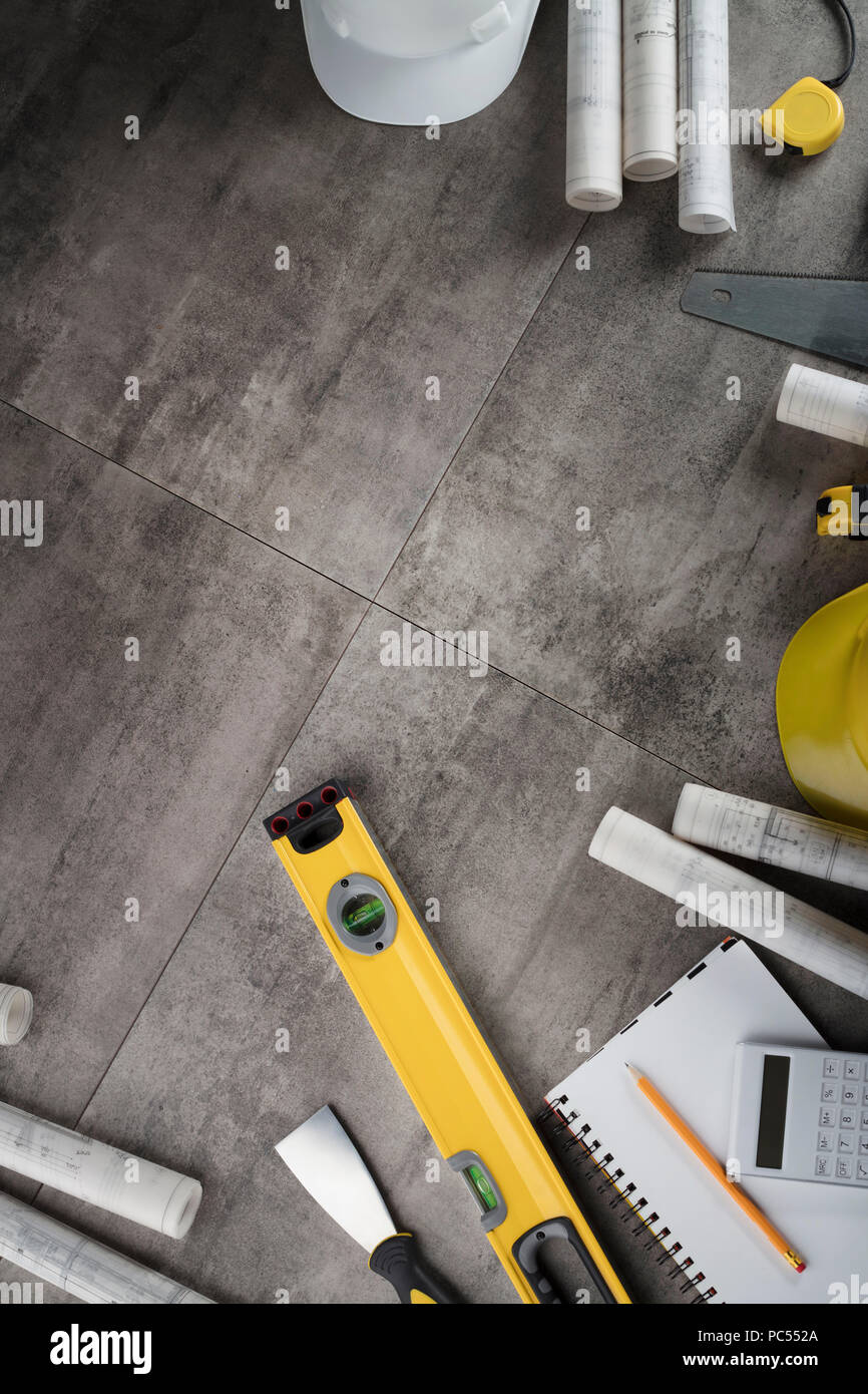 Contractor Ruller Contractor, construction, builder concept. Blueprints, hardhat, level ...