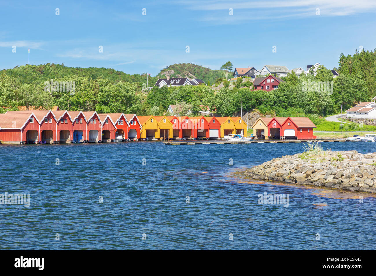 Typical Norwegian boat houses at the waterfront in Svennevik Stock