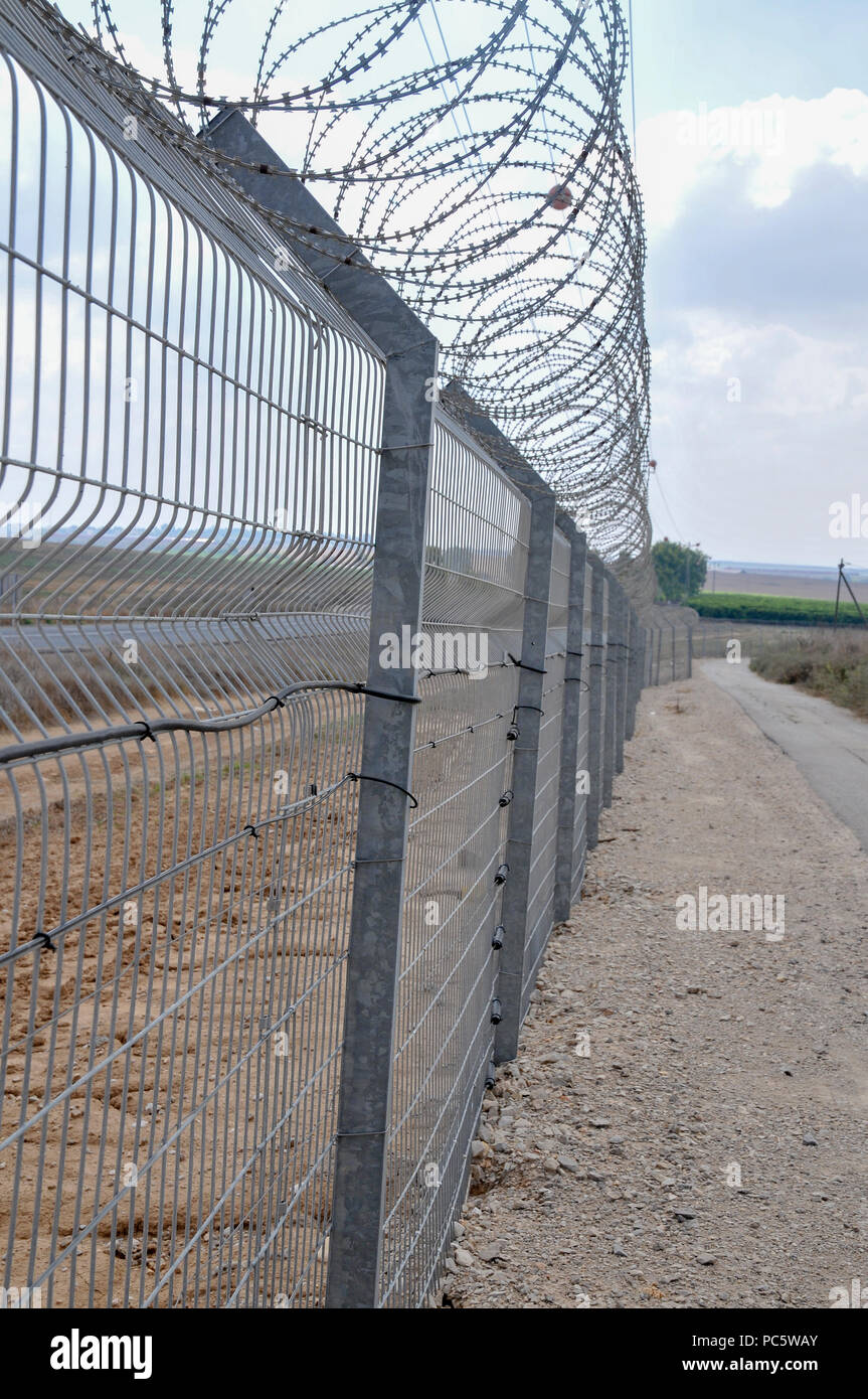 A security fence around a kibbutz on the Gaza border in southern Israel Stock Photo