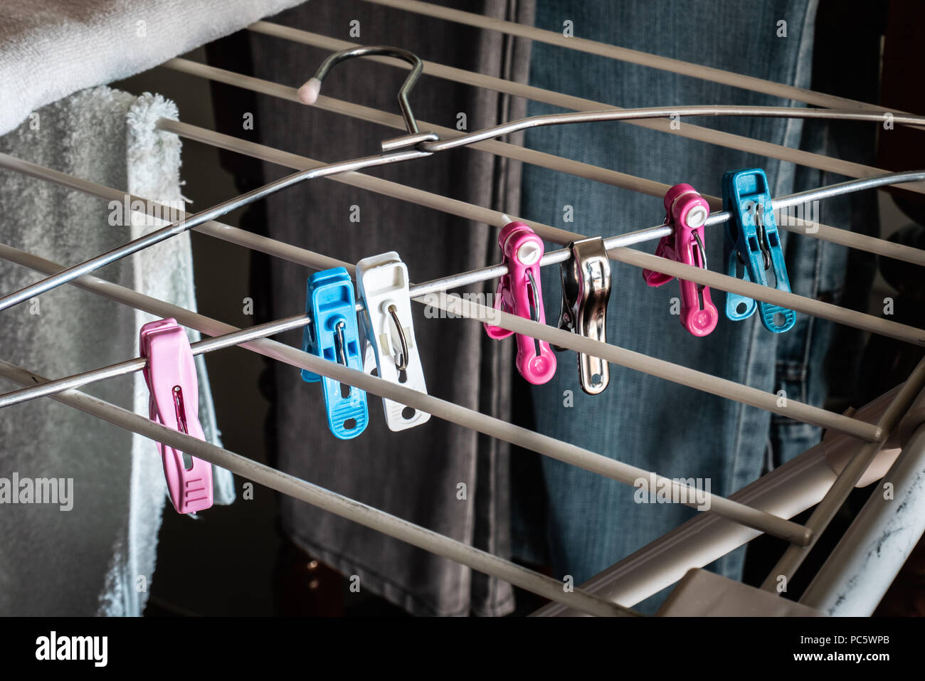 Clothespins with clothes hanger Stock Photo