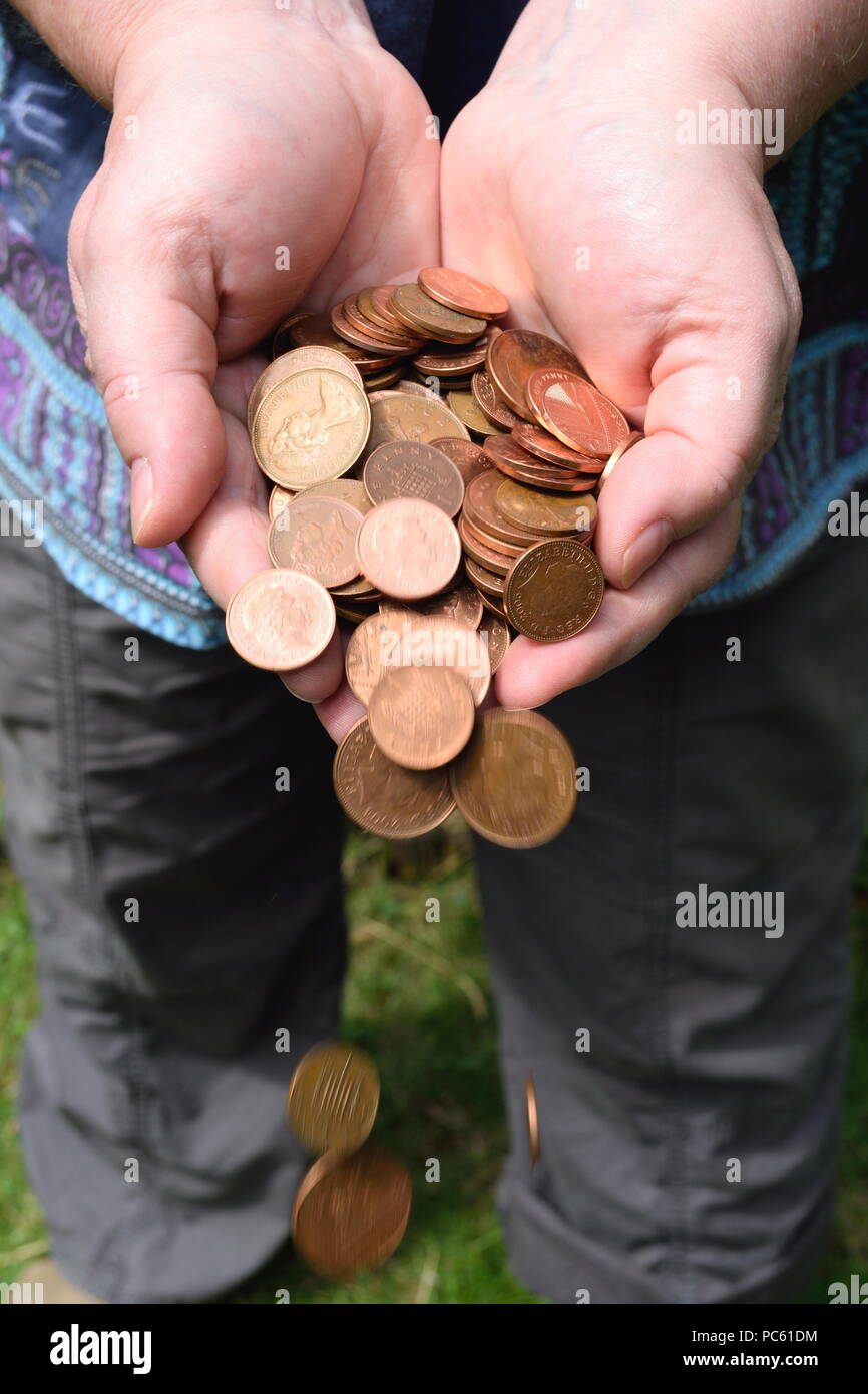 Money pouring from hands Stock Photo