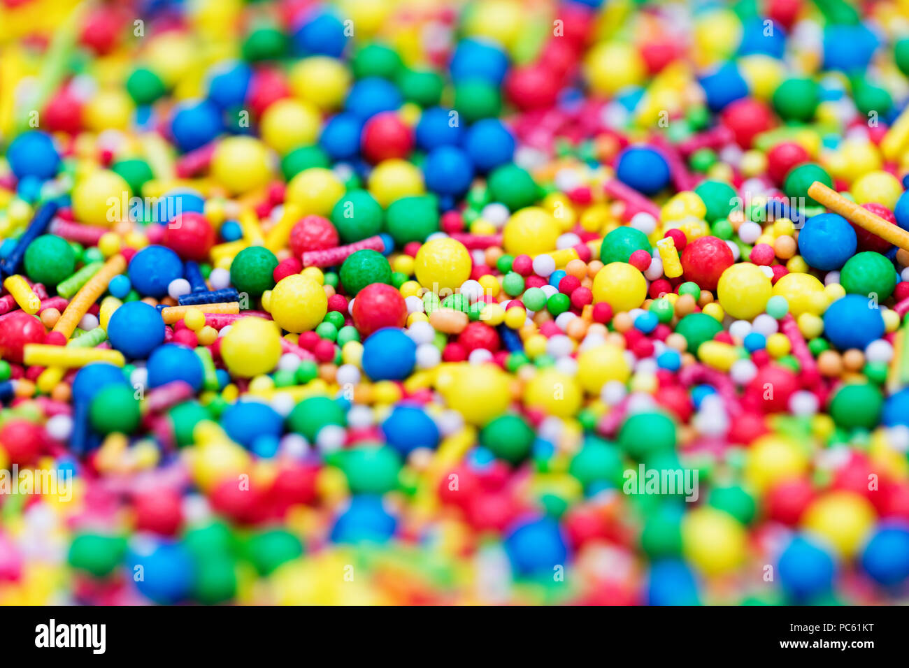 Colourful candy cake decorative sprinkles background Stock Photo